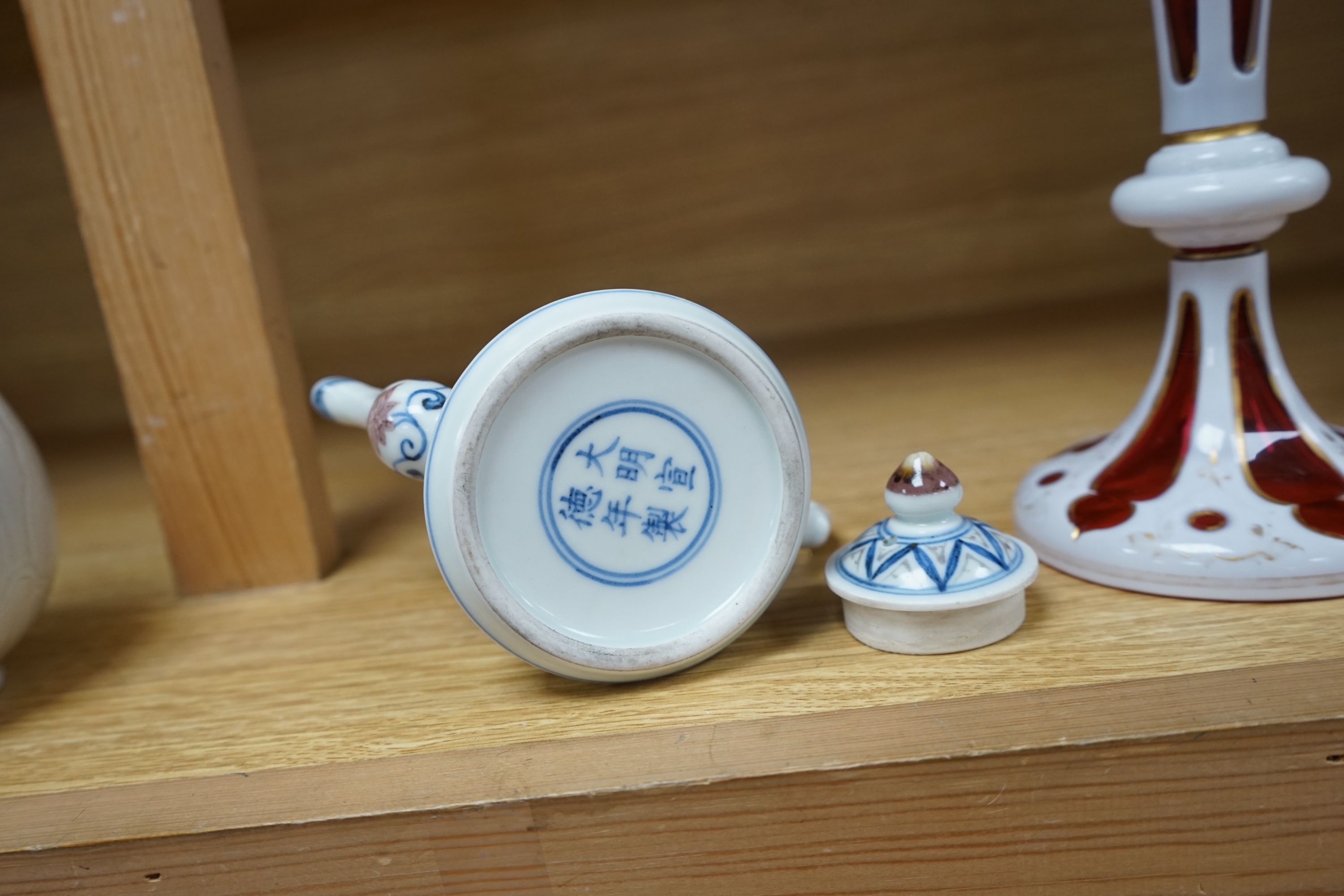 A Chinese carved bottle vase, 18cm high, and a small teapot. Condition - fair to good.